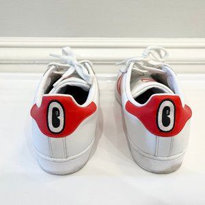 Adidas x Hattie Stewart Superstars with embroidered red eyes